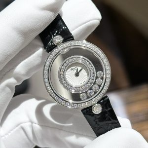 a hand wearing a white glove holding a watch